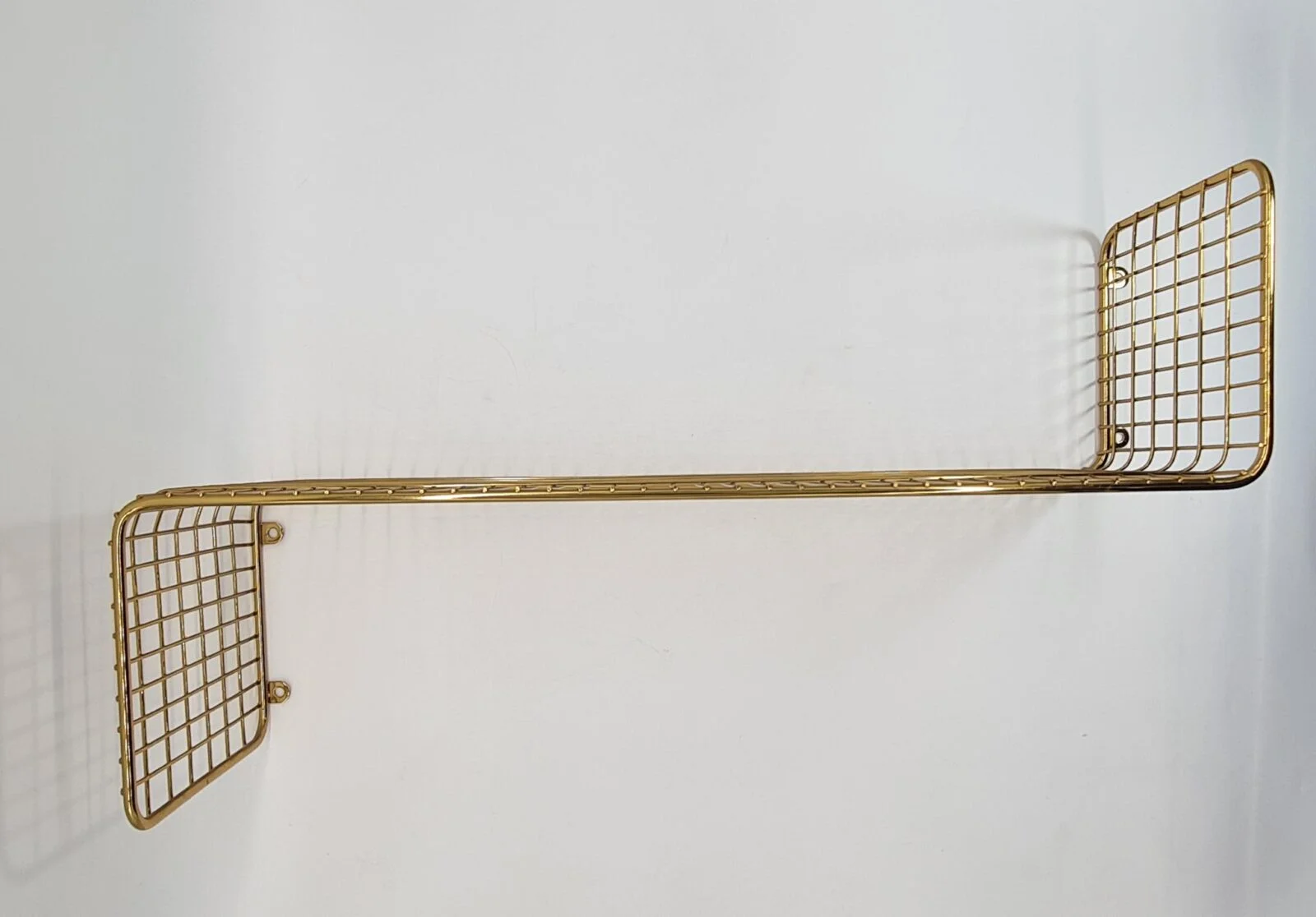 Gold wire-mesh wall shelf, 1970s