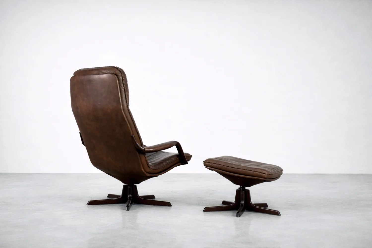 Leather armchair with footstool, Berg Furniture, Denmark, 1970s